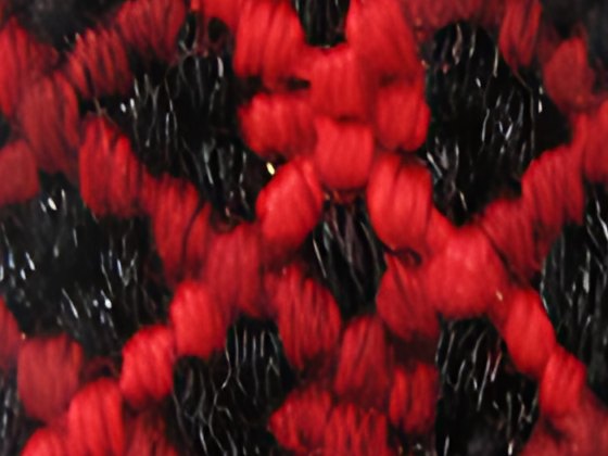 The same bracelet enlarged four times by the AI model: individual threads visible