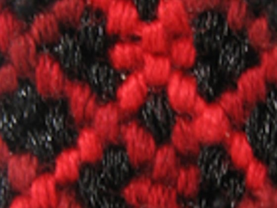 A woven bracelet enlarged four times the ordinary way: blurry threads